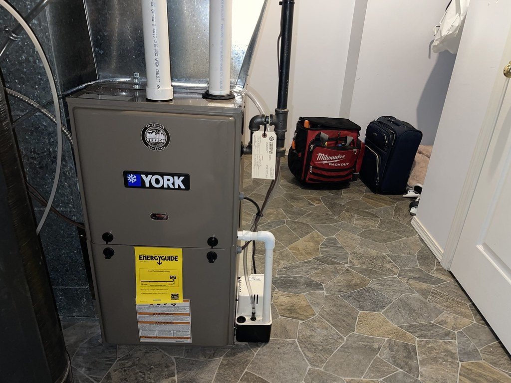 Gas furnace with a condensate pump in a utility room