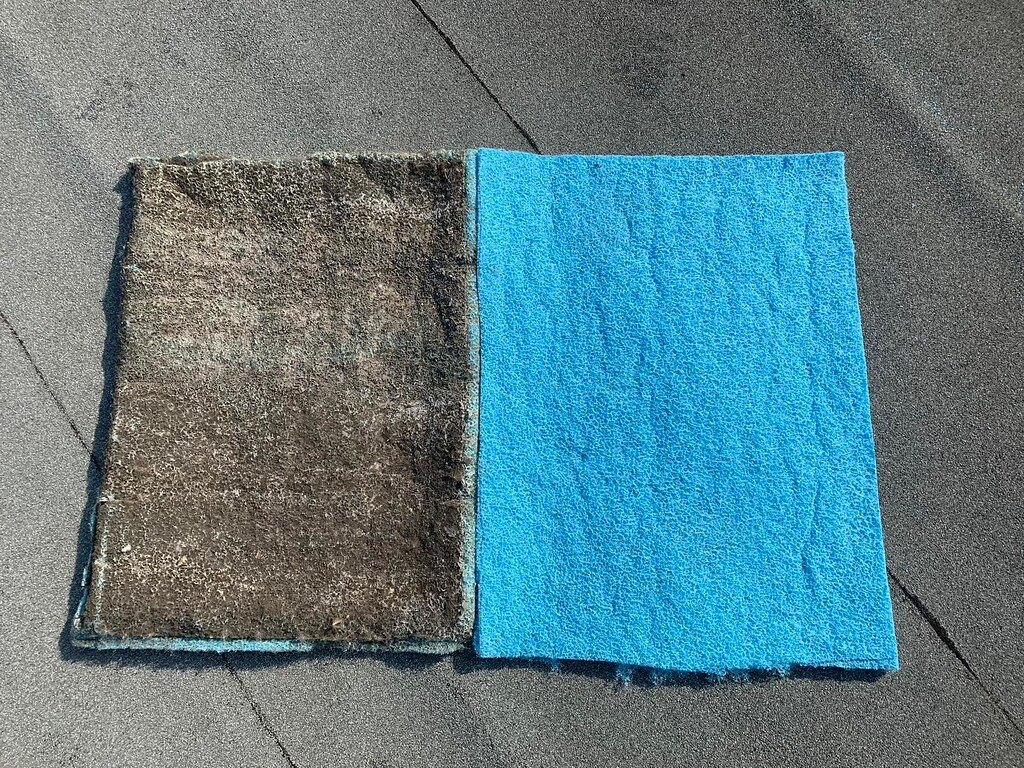 Used filter media next to a new pad, showing how much dirt builds up